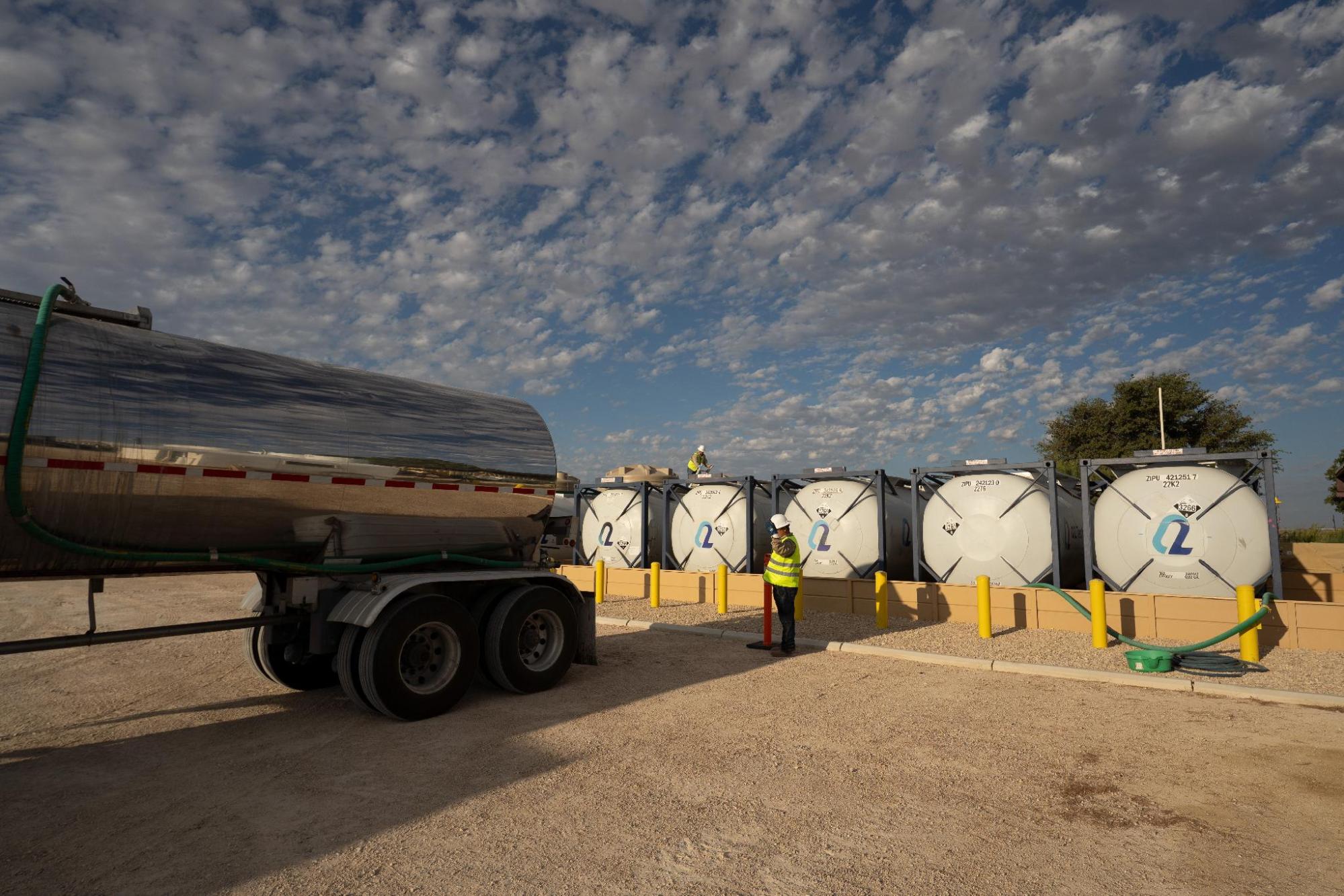Hazmat placarded tanker truck transporting H2S scavenger chemical